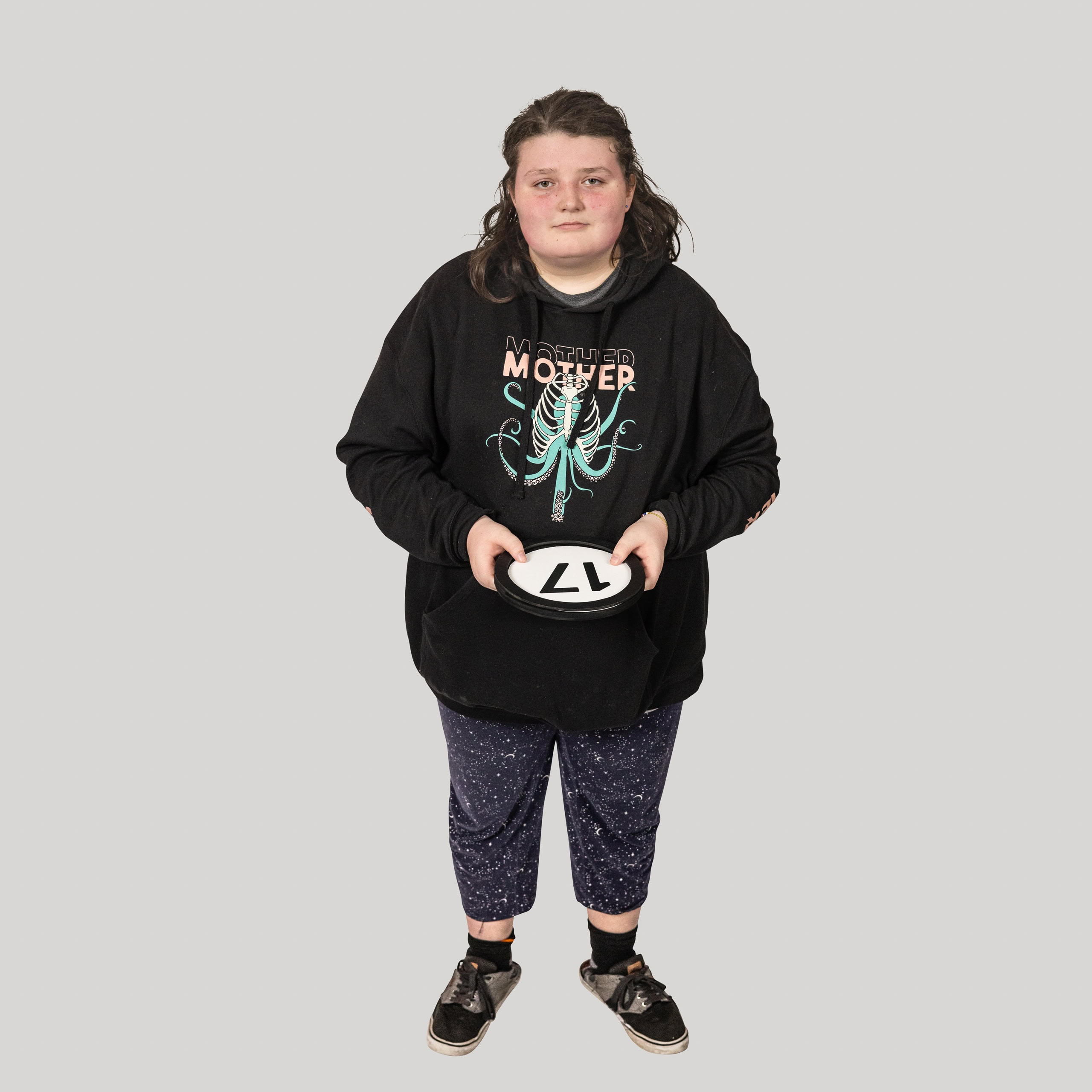 17-year-old woman holds the number 17 in the 1 to Infinity, MIT portrait series by Danny Goldfield.
